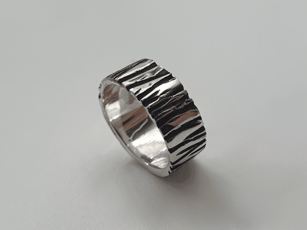 Shard Ring – Carved Silver with Angular Texture and Oxidised Detail carved silver ring with bold angular texture and oxidised detail