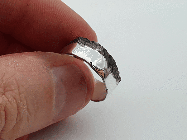 ascent-held-3 handcrafted silver ring with black ridge and polished band