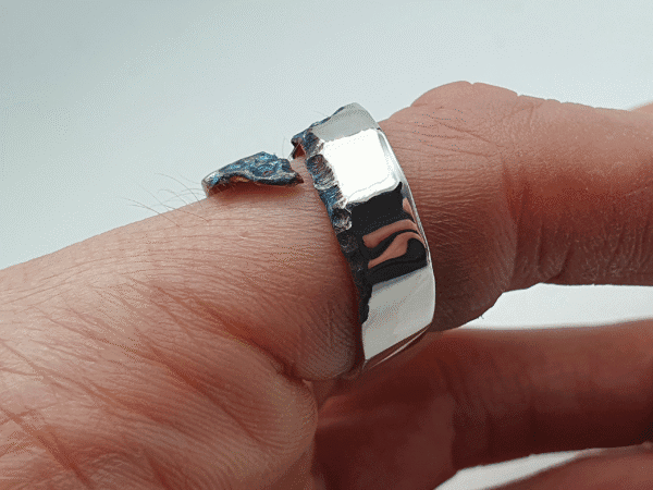 Celestia Ring, Shiny Silver with Deep Blue Oxidised Pattern, Side View Celestia Ring, shiny silver with deep blue oxidised pattern, side view