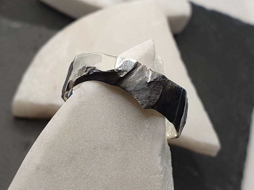 oxidised silver ring with eroded rock-like texture – Erode