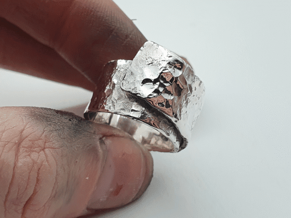 Eon Arc Ring – Curved Sterling Silver with Reflective Texture Eon Arc ring – curved sterling silver ring with reflective texture