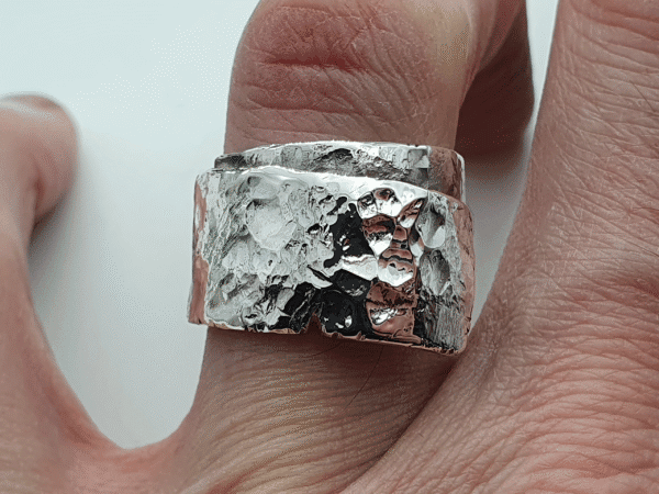 wraparound sterling silver ring with hammered surface and fluid design wraparound silver ring with hammered surface and fluid design