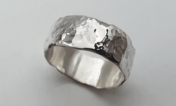 Eon Echo Ring, silver with cratered texture symbolising time and connection Eon Echo Ring, silver with cratered texture symbolising time and connection