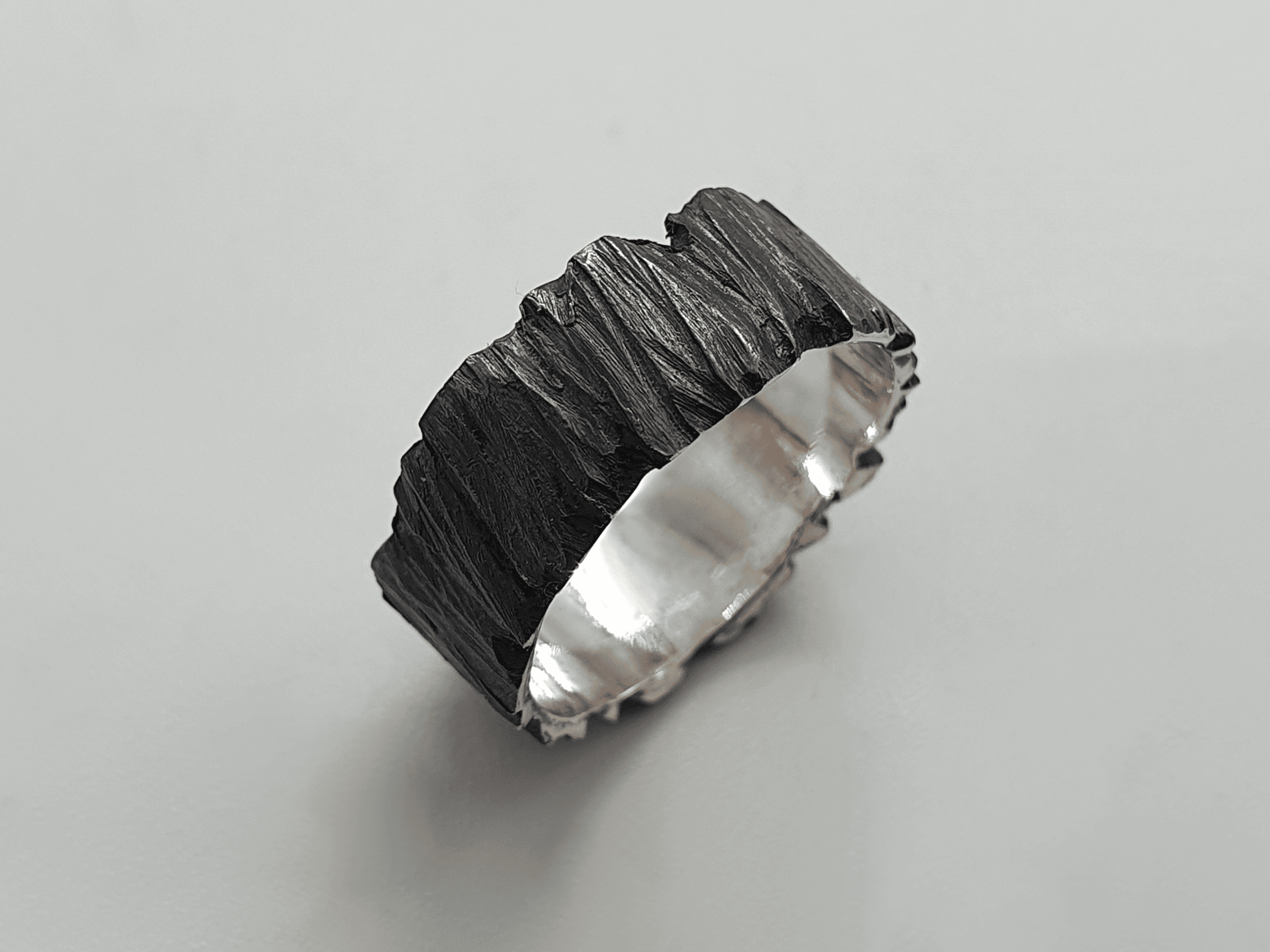oblivion-2 dark oxidised silver ring with handcrafted detail – angled view