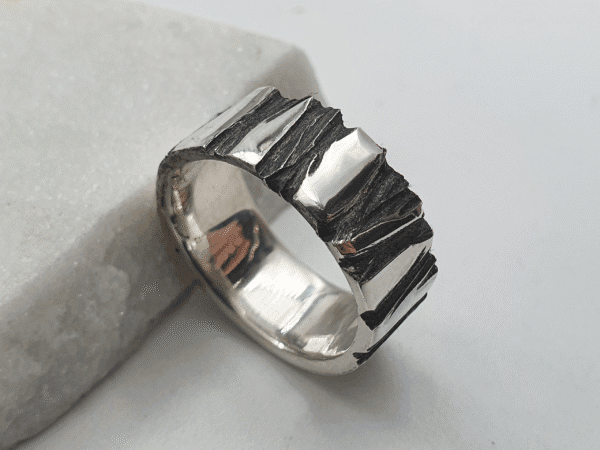 oxidised-silver-ring-fractur-left oxidised silver ring with black textured crevices – left angle