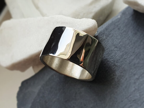 Detail of Prism ring Close-up detail of polished silver prism ring surface